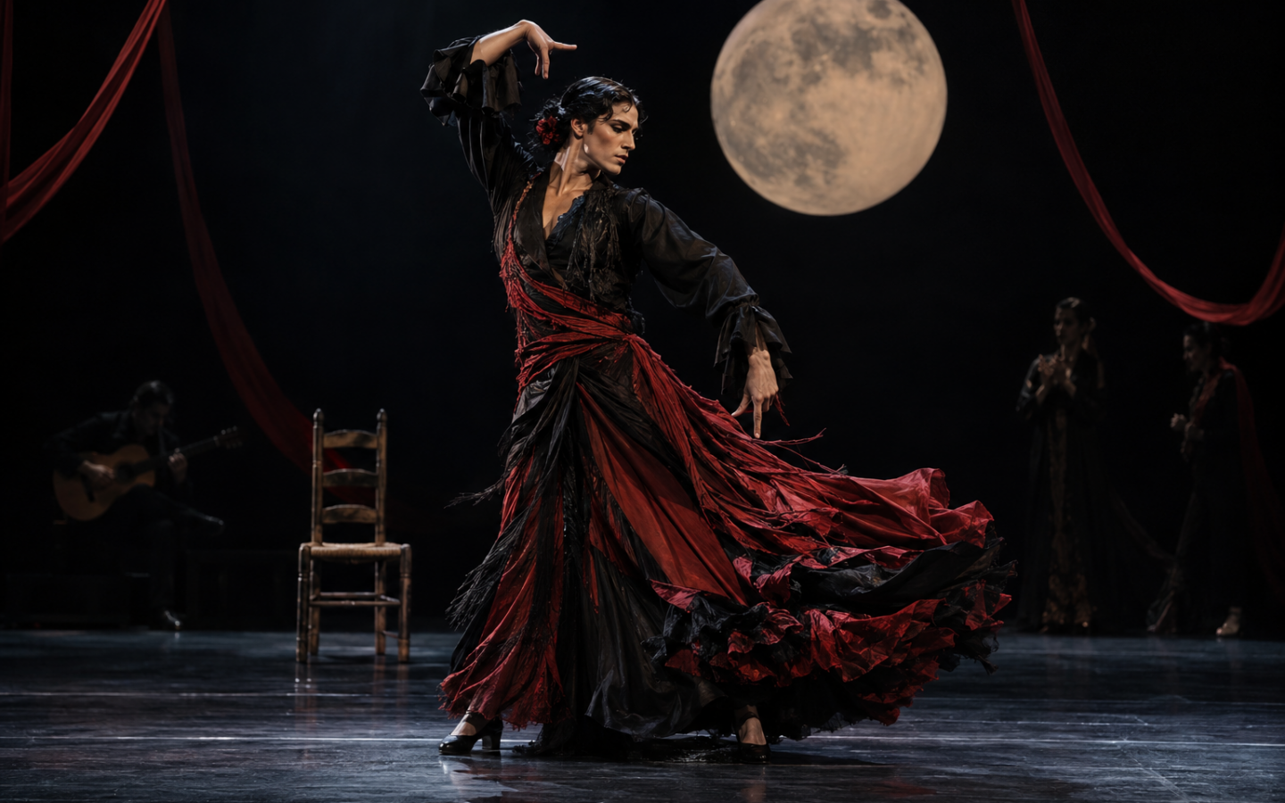 Intérprete de flamenco contemporáneo bajo una luna escénica y telas rojas